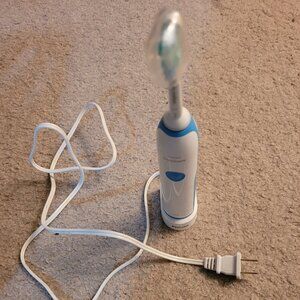New, never used sonicare electric toothbrush with charging base